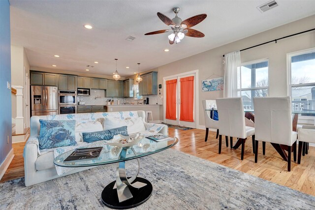 126 Driftwood, Freeport, TX 77541 - living room featuring light wood-type flooring, a ceiling fan, recessed lighting, and baseboards