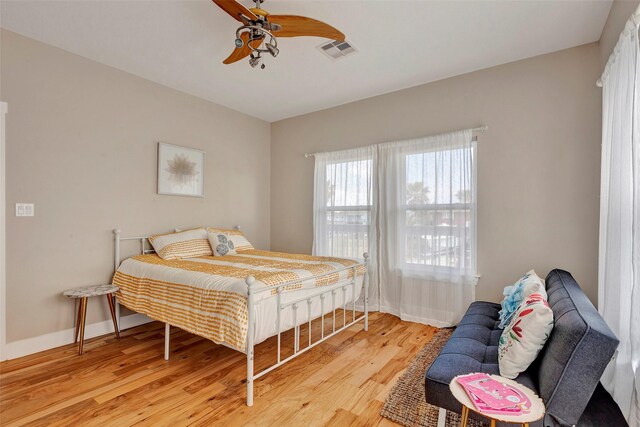126 Driftwood, Freeport, TX 77541 - bedroom featuring light wood-type flooring, a ceiling fan, and baseboards