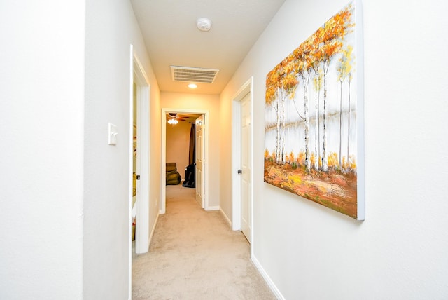 hallway featuring baseboards, visible vents, carpet floors, and recessed lighting