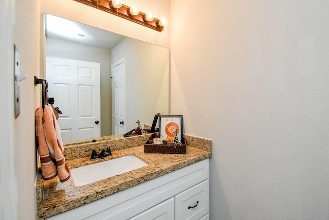 bathroom with visible vents and vanity