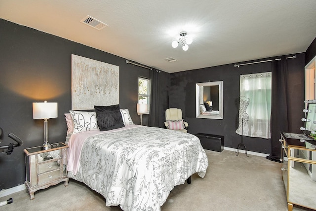 bedroom featuring baseboards, visible vents, and carpet floors
