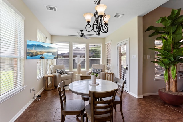 7410 Norwood Point Ct, Richmond, TX 77407 - dining area with baseboards, a ceiling fan, and a chandelier