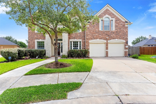 7410 Norwood Point Ct, Richmond, TX 77407 - view of front of house with brick siding, driveway, and an attached garage