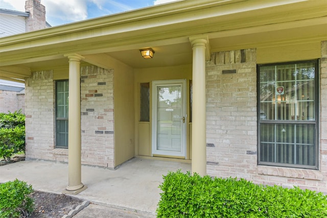 17707 Smooth Rock Falls Dr, Spring, TX 77379 - doorway to property with brick siding and covered porch