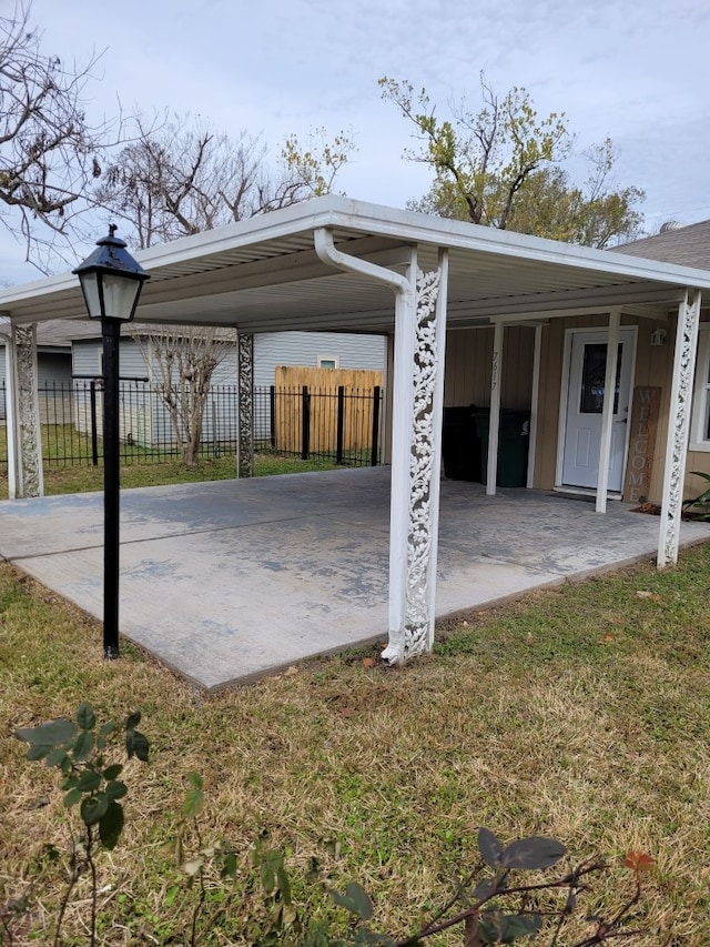 view of parking with fence