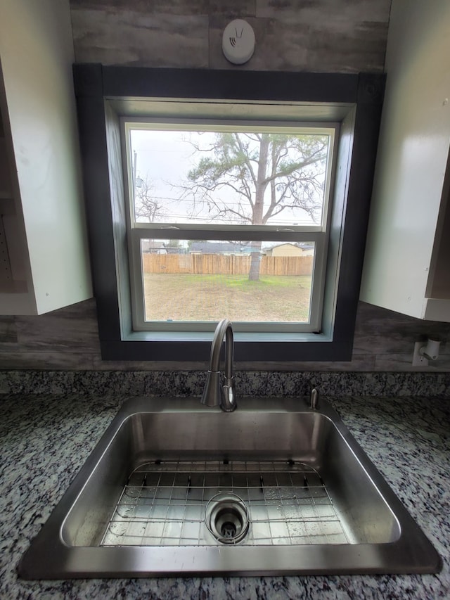 room details with a sink and tasteful backsplash
