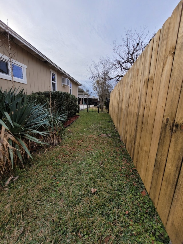 view of yard with a fenced backyard
