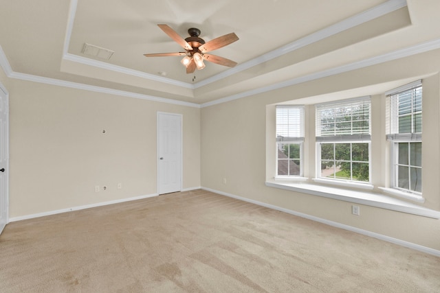2830 Meadowbrook Ln, Rosenberg, TX 77471 - carpeted spare room with a ceiling fan, crown molding, a tray ceiling, baseboards, and visible vents
