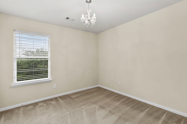 2830 Meadowbrook Ln, Rosenberg, TX 77471 - unfurnished room with baseboards, carpet flooring, a chandelier, and visible vents