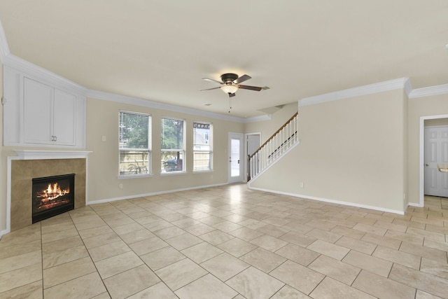2830 Meadowbrook Ln, Rosenberg, TX 77471 - unfurnished living room with a ceiling fan, ornamental molding, baseboards, a fireplace, and stairs