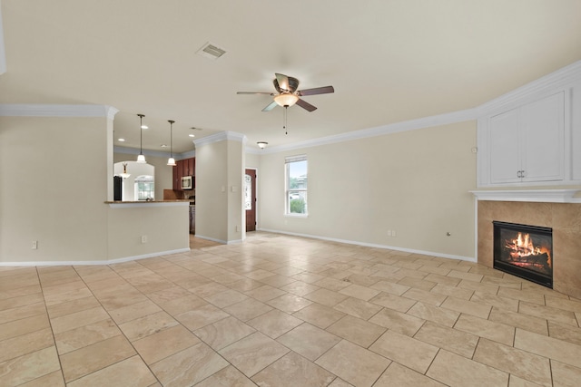 2830 Meadowbrook Ln, Rosenberg, TX 77471 - unfurnished living room with a tile fireplace, visible vents, a ceiling fan, ornamental molding, and baseboards