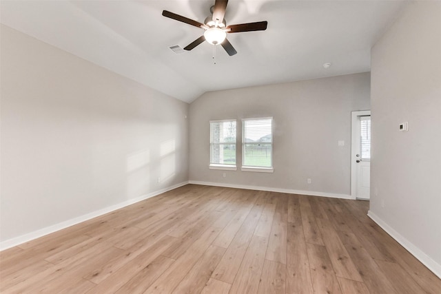 empty room featuring visible vents, a ceiling fan, light wood-style floors, and a wealth of natural light