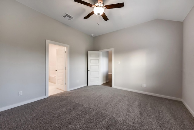 unfurnished bedroom with visible vents, baseboards, connected bathroom, carpet, and vaulted ceiling