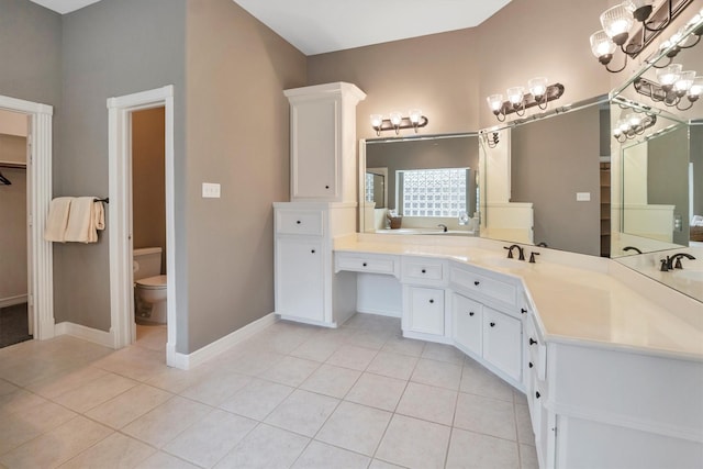 full bath featuring baseboards, an inviting chandelier, toilet, and tile patterned flooring