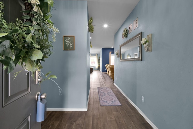 corridor featuring recessed lighting, wood finished floors, and baseboards