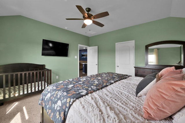 bedroom featuring lofted ceiling, a ceiling fan, and carpet flooring
