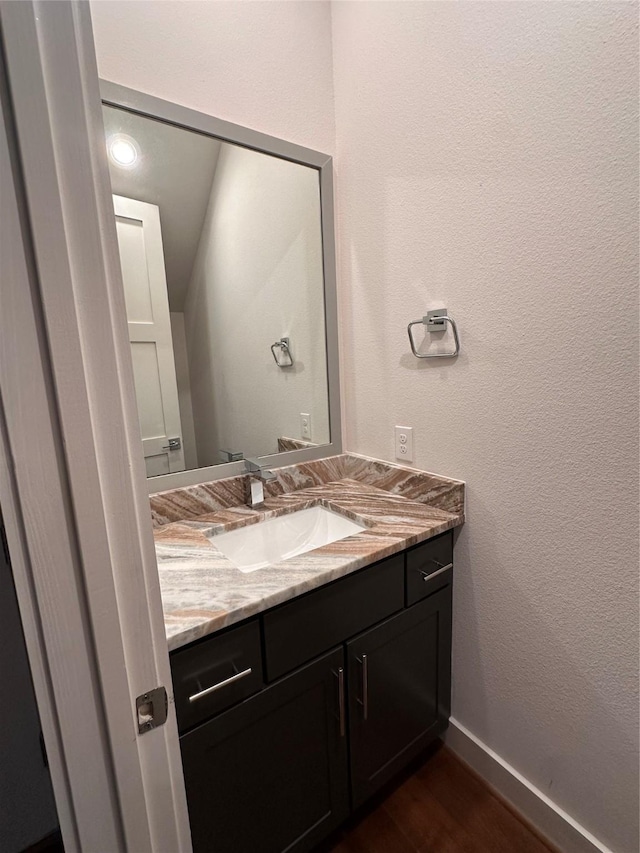 2409 Webster St, Houston, TX 77003 - bathroom featuring vanity and wood finished floors