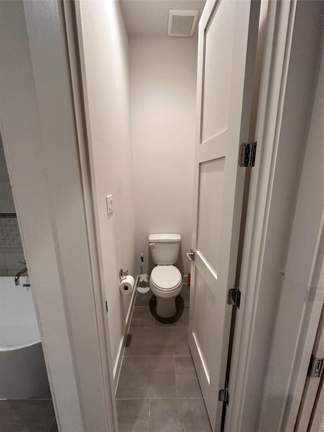 2409 Webster St, Houston, TX 77003 - bathroom with tile patterned floors and a bath