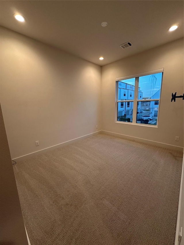 2409 Webster St, Houston, TX 77003 - empty room with recessed lighting and light colored carpet