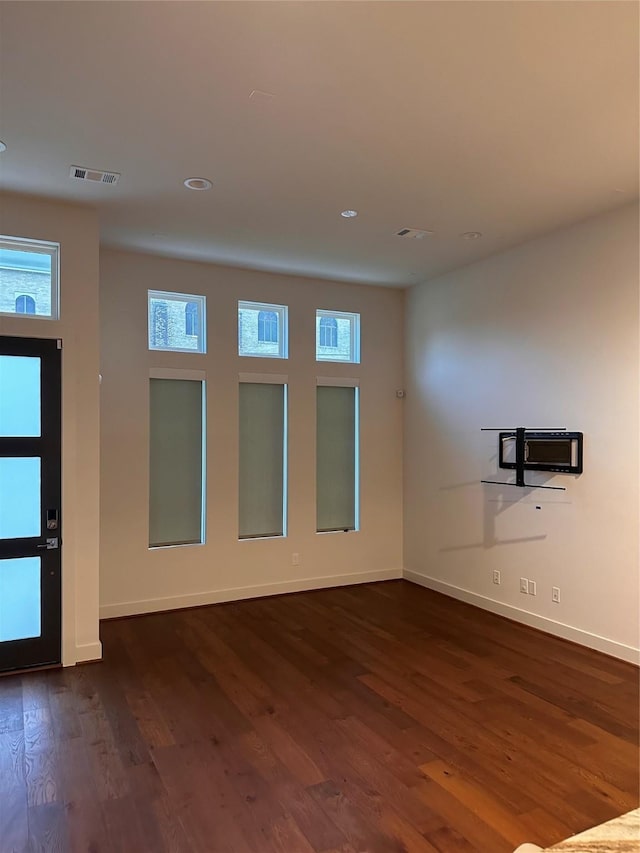 2409 Webster St, Houston, TX 77003 - unfurnished room featuring dark wood-type flooring and recessed lighting