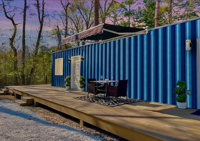 view of outdoor structure featuring outdoor dining area