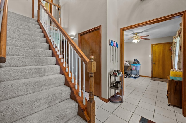 5922 Redfish Run, Baytown, TX 77523 - stairway featuring a ceiling fan, tile patterned flooring, and baseboards