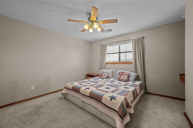 5922 Redfish Run, Baytown, TX 77523 - carpeted bedroom with baseboards, visible vents, ceiling fan, and a textured ceiling