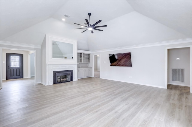 unfurnished living room featuring vaulted ceiling, visible vents, a fireplace, and ceiling fan