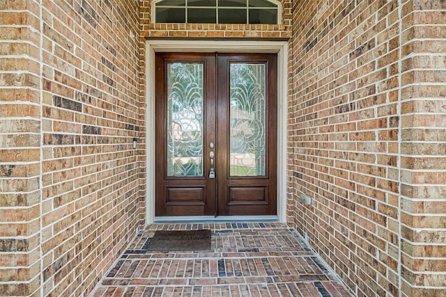 20322 Fossil Valley Ln, Cypress, TX 77433 - property entrance featuring french doors and brick siding
