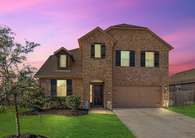 18203 Octavio Frias Trl, Atascocita, TX 77044 - traditional-style house featuring fence, an attached garage, brick siding, concrete driveway, and a front lawn