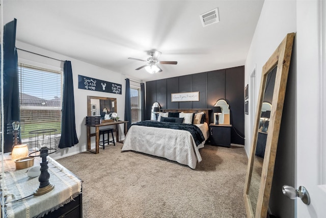 18203 Octavio Frias Trl, Atascocita, TX 77044 - carpeted bedroom with multiple windows, visible vents, and ceiling fan