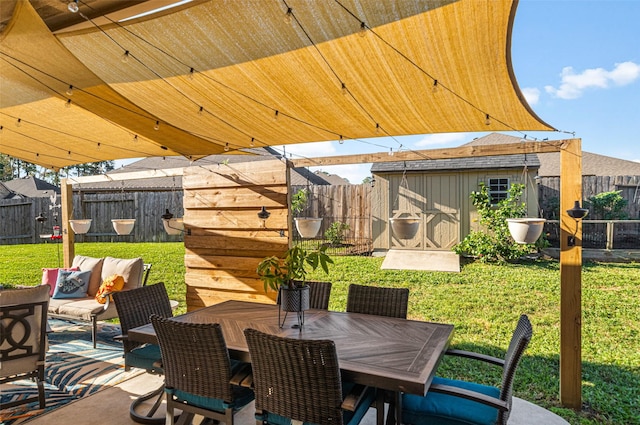 18203 Octavio Frias Trl, Atascocita, TX 77044 - view of patio featuring a fenced backyard, an outdoor structure, outdoor dining area, and a storage unit