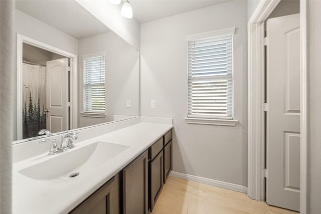 18203 Octavio Frias Trl, Atascocita, TX 77044 - bathroom with vanity and baseboards