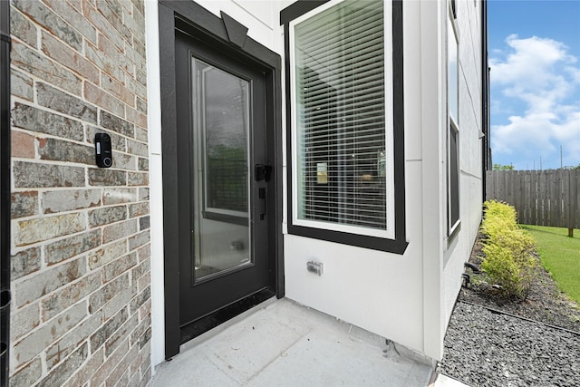property entrance featuring fence