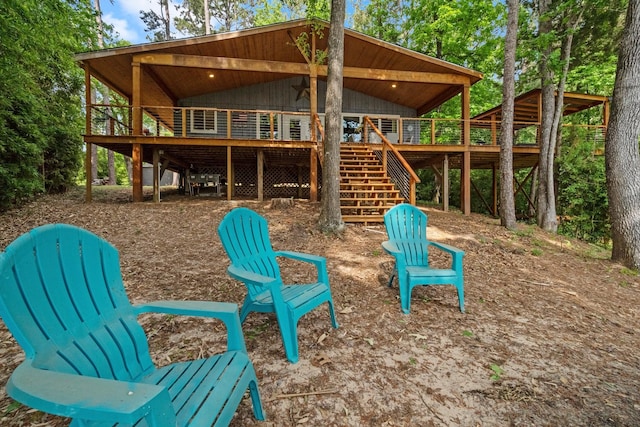 view of play area featuring stairs and a deck