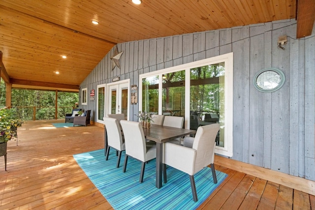 deck featuring outdoor dining space and french doors