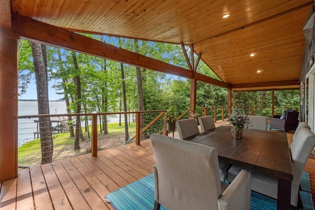 sunroom / solarium with a wealth of natural light and a water view