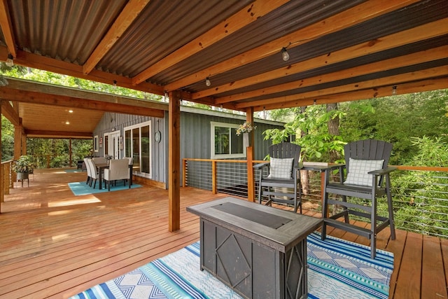 deck with outdoor dining area