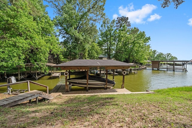 view of dock featuring boat lift and a water view
