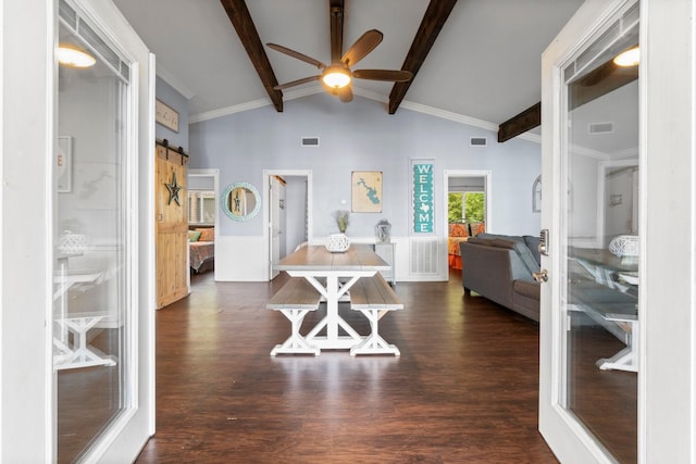 interior space with a barn door, dark wood-style floors, visible vents, beam ceiling, and ceiling fan