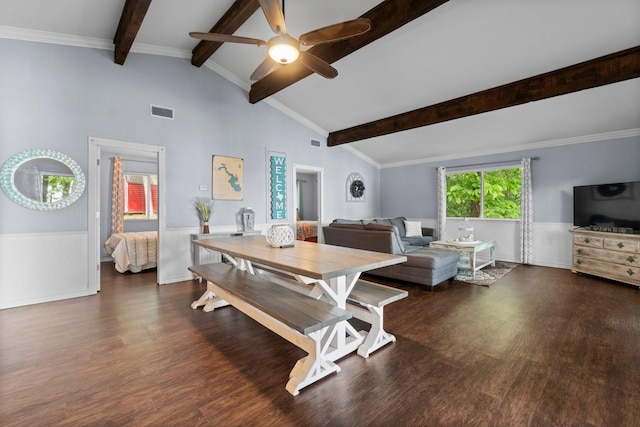 dining space with wood finished floors, a wainscoted wall, visible vents, and ceiling fan