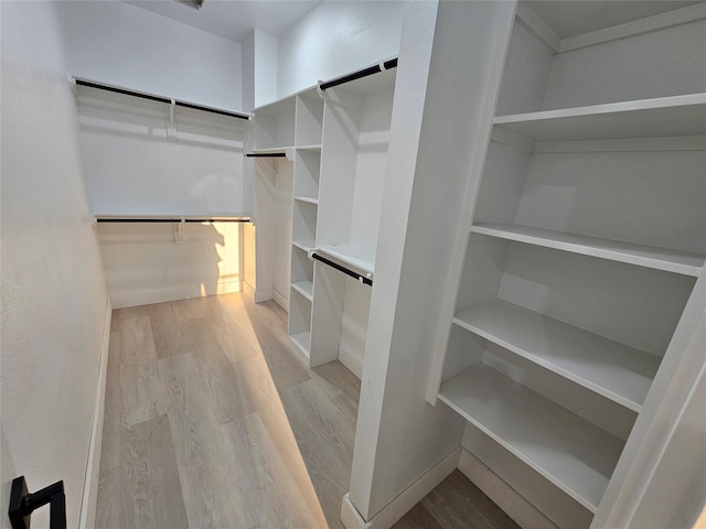 8131 Woodward St, Houston, TX 77051 - walk in closet with light wood-type flooring