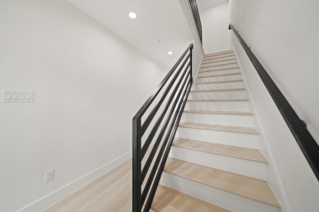 8131 Woodward St, Houston, TX 77051 - stairs featuring recessed lighting and wood finished floors