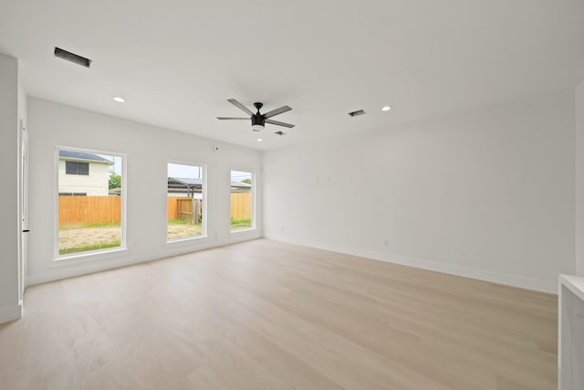 8131 Woodward St, Houston, TX 77051 - empty room featuring light wood-style flooring, a ceiling fan, and recessed lighting