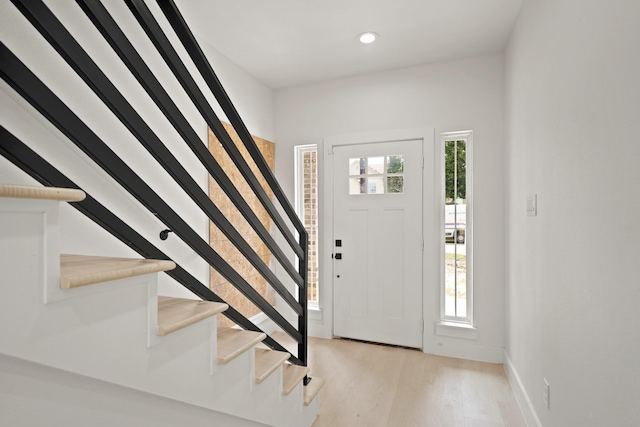 8131 Woodward St, Houston, TX 77051 - foyer with stairway, light wood-type flooring, and recessed lighting