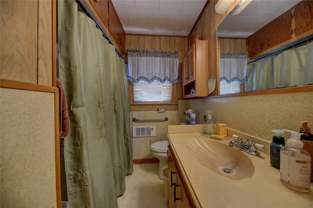 bathroom featuring toilet, vanity, curtained shower, and visible vents