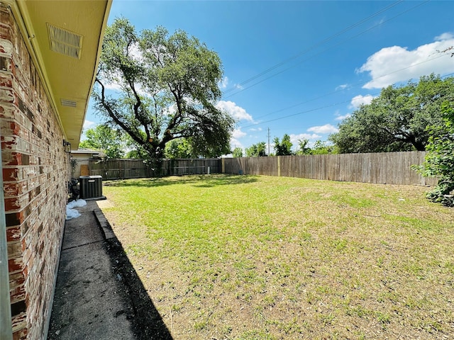 view of yard with central AC