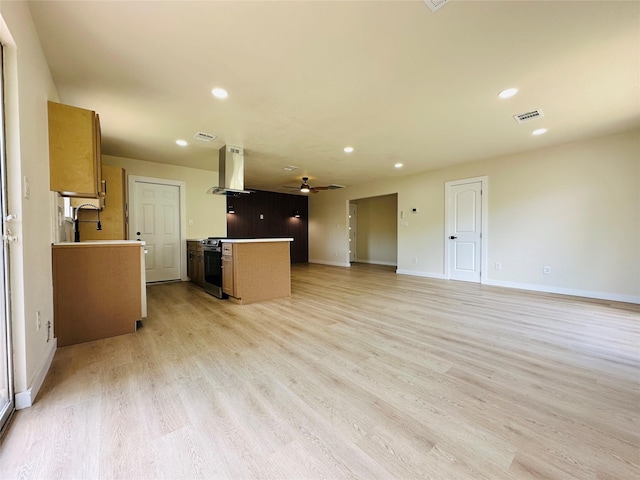 unfurnished living room featuring recessed lighting, light wood finished floors, baseboards, and a ceiling fan