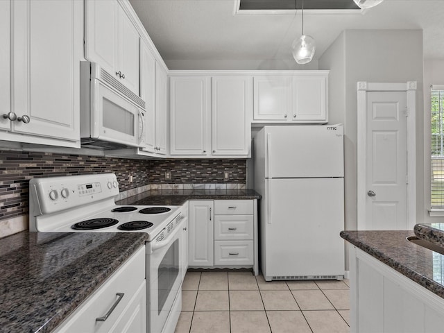 kitchen featuring white cabinets, tasteful backsplash, and white appliances