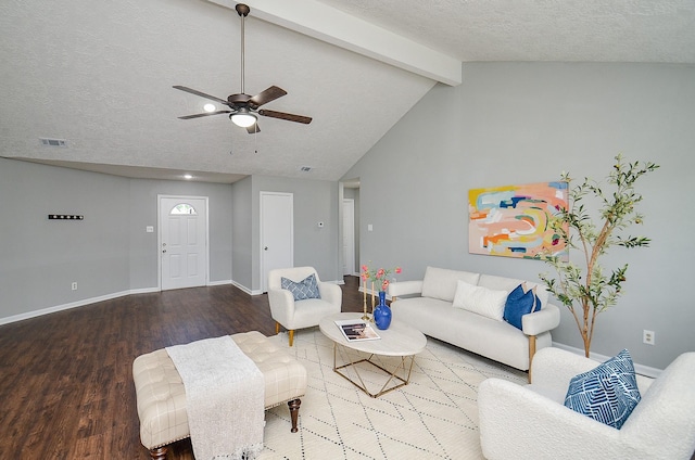 living room featuring wood finished floors, visible vents, a ceiling fan, and baseboards